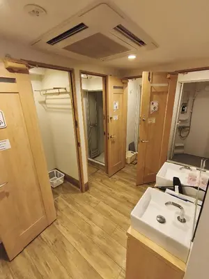 a bathroom with a sink and a mirror at A16 HOSTEL TOKYO in Tokyo