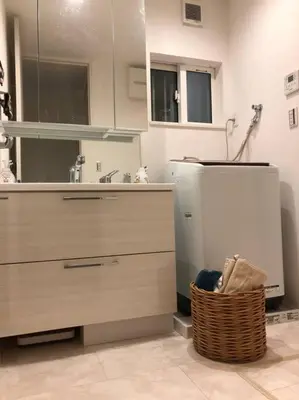a kitchen with a sink and a wicker basket at Tanuki Shinjuku in Tokyo