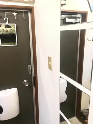 a bathroom with a door and a mirror at 10 minutes direct to Shibuya Crossing! Heart of Tokyo! Kamiuma in Tokyo