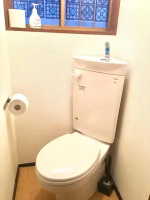 a white toilet in a bathroom with a window at 10 minutes direct to Shibuya Crossing! Heart of Tokyo! Kamiuma in Tokyo