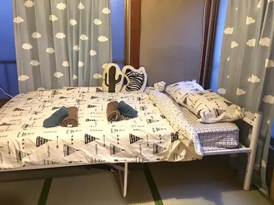 a childs bed with a crib in a bedroom at 10 minutes direct to Shibuya Crossing! Heart of Tokyo! Kamiuma in Tokyo