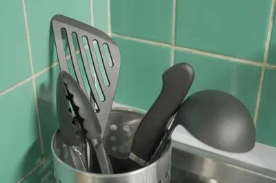 a metal container filled with kitchen utensils on a counter at \u62b9\u8336\u5eb5\u4e16\u7530\u8c37\u6771\u4eac Matcha-An Setagaya Tokyo in Tokyo