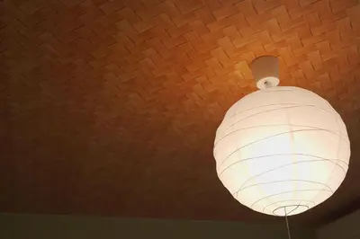 a white light fixture hanging from a ceiling at \u62b9\u8336\u5eb5\u4e16\u7530\u8c37\u6771\u4eac Matcha-An Setagaya Tokyo in Tokyo