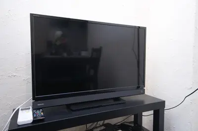 a flat screen tv sitting on top of a table at Yutaka bldg.302 in Tokyo
