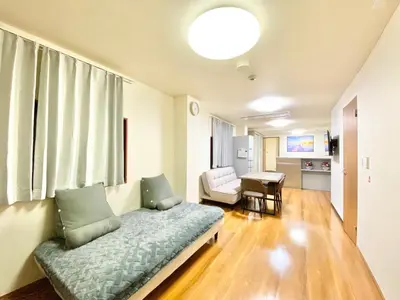 a living room with a couch and a chair at Asakusa\u6b63\u548cHouse in Tokyo