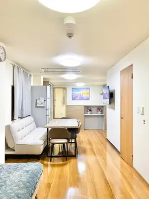 a living room with a couch and a table at Asakusa\u6b63\u548cHouse in Tokyo