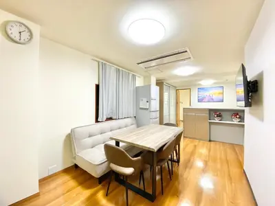 a kitchen and dining room with a table and chairs at Asakusa\u6b63\u548cHouse in Tokyo