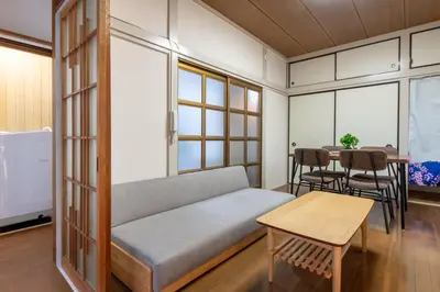 a living room with a couch and a table at \u795e\u8c37\u6238\u5efa in Tokyo