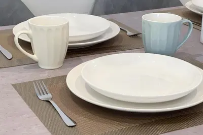 a table with plates and cups and a fork and knife at \u5343\u99c4\u6728\u6238\u5efa in Tokyo