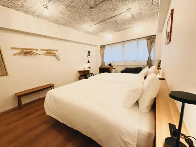 a bedroom with a white bed and a window at HERE.Tokyo in Tokyo