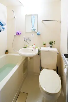 a bathroom with a toilet and a sink and a bath tub at SC 102 Cozy Private Stay with Loft Near Station Free WiFi in Tokyo