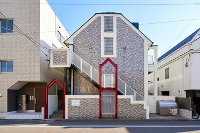 a staircase on the side of a building at SC 102 Cozy Private Stay with Loft Near Station Free WiFi in Tokyo