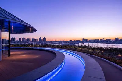 a view of a city skyline from a building at Tokyo Toyosu Manyo Club in Tokyo