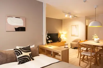 a living room with a couch and a table at \u672b\u677e\u30d3\u30eb -Tokyo lifestyle apartment- in Tokyo