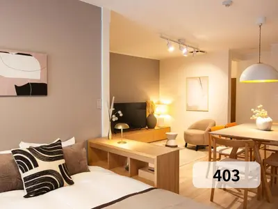 a living room with a couch and a table at \u672b\u677e\u30d3\u30eb -Tokyo lifestyle apartment- in Tokyo