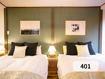 two beds sitting next to each other in a bedroom at \u672b\u677e\u30d3\u30eb -Tokyo lifestyle apartment- in Tokyo