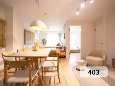 a dining room and living room with a table and chairs at \u672b\u677e\u30d3\u30eb -Tokyo lifestyle apartment- in Tokyo