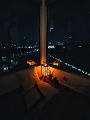 a bedroom with a bed and a window at night at \u6795\u6728 New house with Huge View for Family-Group in Tokyo