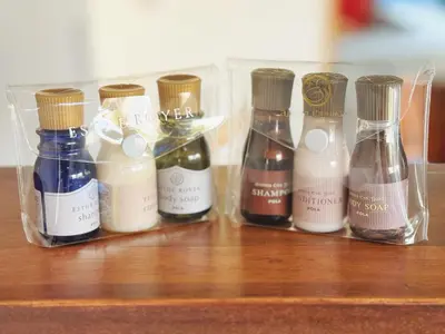 a group of bottles of oils sitting on a wooden shelf at \u6795\u6728 New house with Huge View for Family-Group in Tokyo