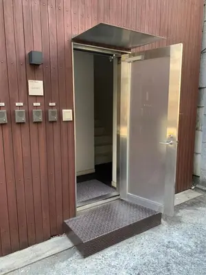 an entrance to a building with an open door at 彩光堂Village KAME101&202 in Tokyo