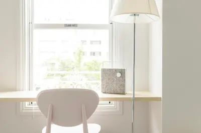 a white desk with a chair and a lamp at Hotel Re:ONcE Shibuya in Tokyo