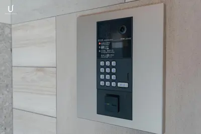 a control panel on a wall in a bathroom at unito residence HIKAWADAI in Tokyo