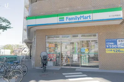 a store front with a bike parked outside of it at unito residence HIKAWADAI in Tokyo