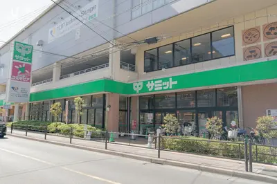 a store front of a building on a street at unito residence HIKAWADAI in Tokyo