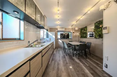 a kitchen with a table and a dining room at 2 shower rooms #Shinjuku 5 min walk from station ,projector in Tokyo