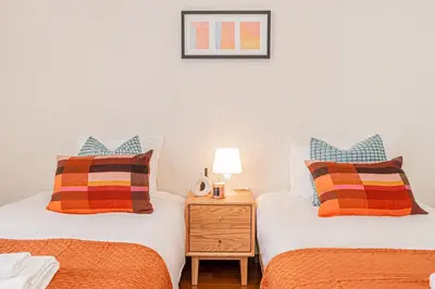 two beds sitting next to each other in a bedroom at Mi-WIND SHINJUKU in Tokyo