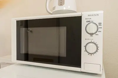 a microwave oven sitting on top of a counter at Mi-WIND SHINJUKU in Tokyo