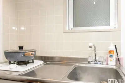 a kitchen sink with a pot on top of it at Mi-WIND SHINJUKU in Tokyo