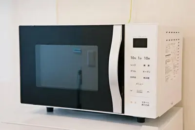 a microwave oven sitting on top of a table at \u30ea\u30ea\u30cf\u30a6\u30b9\u7b39\u585a in Tokyo
