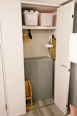 a closet with a door open with some dishes on it at \u30ea\u30ea\u30cf\u30a6\u30b9\u7b39\u585a in Tokyo