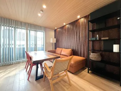 a living room with a table and a couch at Zut Shinjuku House-SJ0415 in Tokyo