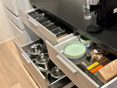 a kitchen with an open drawer with dishes at Zut Shinjuku House-SJ0415 in Tokyo