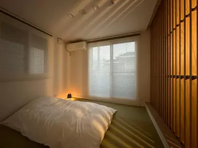 a bedroom with a white bed and a window at Zut Shinjuku House-SJ0415 in Tokyo