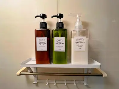 three bottles sitting on a shelf in a closet at \u30e1\u30be\u30f3\u30af\u30ec\u30b9\u30bf in Tokyo