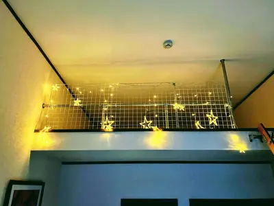 a cage with christmas lights on top of a door at \u30e1\u30be\u30f3\u30af\u30ec\u30b9\u30bf in Tokyo