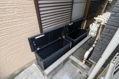 an overhead view of a black door on a building at SENJU Nakacho HOUSE , \u5343\u4f4f\u4ef2\u753aHOUSE in Tokyo