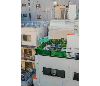 a view from the balcony of a building with a patio at \u66255GWifi TokyoDome\u7687\u5c451km\u301c RoofGarden \u4e0a\u91ce\u79cb\u8449\u539f\u9280\u5ea7\u6771\u4eac2km\uff5e\u90fd\u5fc3 in Tokyo