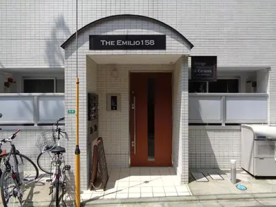 a building with a door with a sign on it at EMILIO Nishi-Shinjuku 101,201,202 - Vacation STAY 64263v in Tokyo