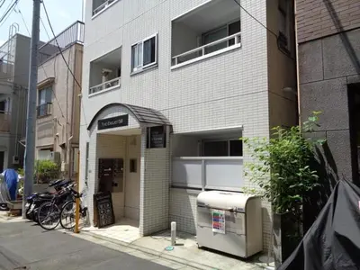 a building with an entrance with a bike parked outside at EMILIO Nishi-Shinjuku 101,201,202 - Vacation STAY 64263v in Tokyo
