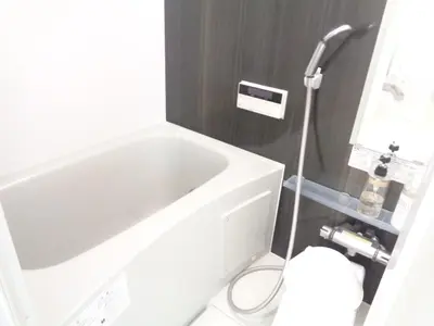 a white bath tub in a small bathroom at EMILIO Nishi-Shinjuku 101,201,202 - Vacation STAY 64292v in Tokyo