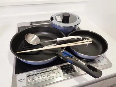 a frying pan and utensils on top of a scale at EMILIO Nishi-Shinjuku 101,201,202 - Vacation STAY 64281v in Tokyo