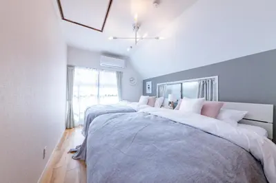 a bedroom with two beds and a large window at HOTEL Y's HOUSE - Vacation STAY 66523v in Tokyo