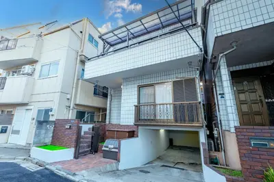 an apartment building with a balcony and a door at HOTEL Y's HOUSE - Vacation STAY 66523v in Tokyo