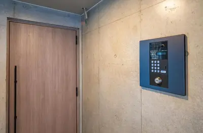 a door in a room next to a wall at Hotel the World Omori in Tokyo