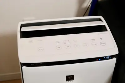 a white toaster oven sitting next to a wall at 100㎡ Cozy Villa in Shinjuku｜JR Shin-Ōkubo Sta. 7mins. in Tokyo