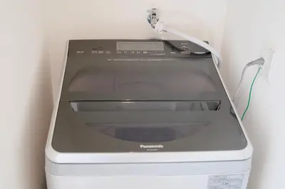 a toaster oven with a cord plugged into a wall at 100㎡ Cozy Villa in Shinjuku｜JR Shin-Ōkubo Sta. 7mins. in Tokyo